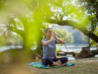 Image showing woman meditating and doing yoga exercise