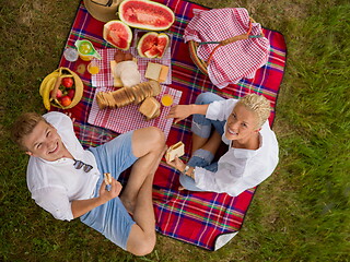 Image showing top view of couple enjoying picnic time