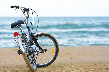 Image showing Close-up bike stands on the sea coast