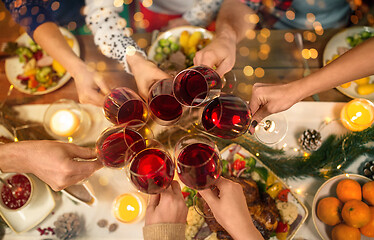 Image showing close up of friends with wine celebrate christmas