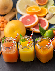 Image showing mason jar glasses of vegetable juices on table