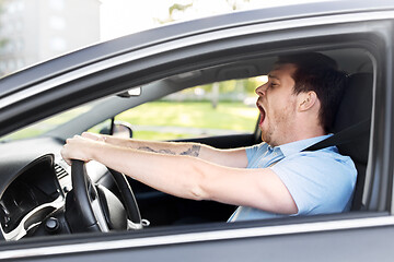 Image showing tired sleepy man or driver driving car and yawning