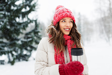 Image showing young woman with hot drink in tumbler in winter