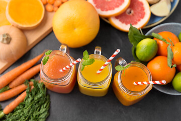 Image showing mason jar glasses of vegetable juices on table