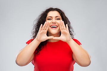 Image showing happy woman in red dress calling