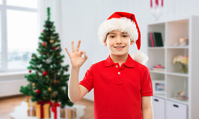 Image showing smiling boy in santa helper hat showing ok gesture