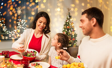 Image showing happy family having christmas dinner at home