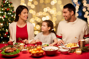 Image showing happy family having christmas dinner at home