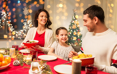 Image showing happy family having christmas dinner at home