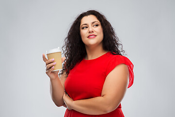 Image showing woman in red dress holding takeaway coffee cup