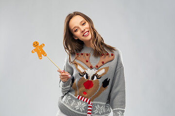 Image showing woman in christmas sweater with reindeer pattern