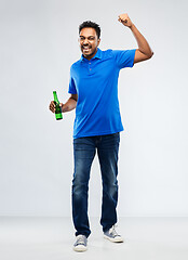 Image showing male fan with beer bottle celebrating victory