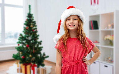 Image showing happy red haired girl in santa helper hat at home