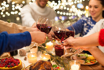 Image showing close up of friends with wine celebrate christmas