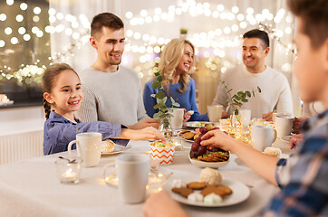 Image showing happy family having tea party at home