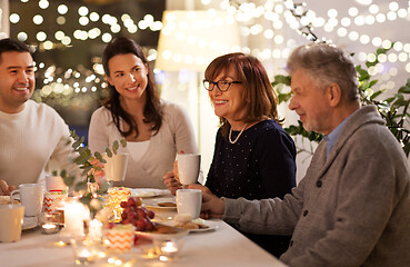 Image showing happy family having tea party at home