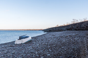 Image showing Rowboat turned upside down by the coast