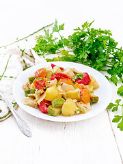 Image showing Ragout vegetable with zucchini on white wooden board