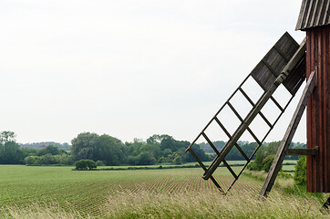 Image showing Old windmill in a farmland 