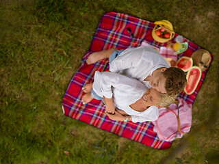 Image showing top view of couple enjoying picnic time