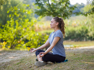 Image showing woman meditating and doing yoga exercise