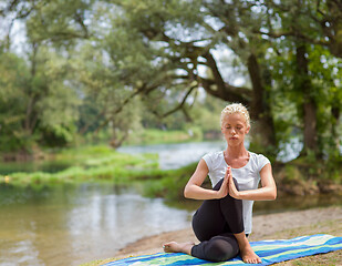 Image showing woman meditating and doing yoga exercise