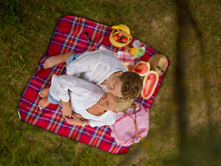 Image showing top view of couple enjoying picnic time