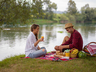 Image showing Couple in love enjoying picnic time