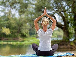 Image showing woman meditating and doing yoga exercise