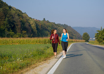 Image showing women jogging along a country road