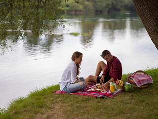 Image showing Couple in love enjoying picnic time