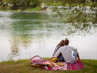 Image showing Couple taking a selfie by mobile phone while enjoying picnic tim