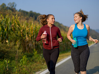 Image showing women jogging along a country road