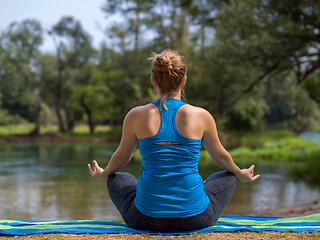 Image showing woman meditating and doing yoga exercise