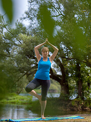 Image showing woman meditating and doing yoga exercise