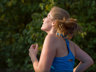 Image showing woman jogging along a country road