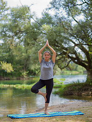 Image showing woman meditating and doing yoga exercise