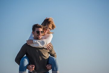 Image showing couple having fun at beach during autumn