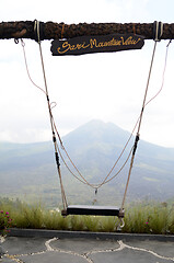 Image showing Wooden swing on the rope with view of Batur volcano