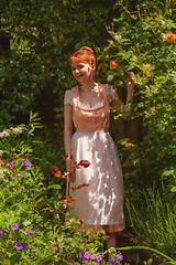 Image showing Happy Bavarian girl in your garden