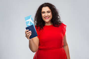 Image showing happy woman with passport and air ticket