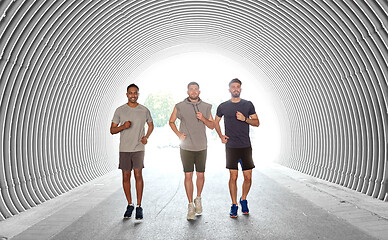 Image showing young men or male friends running outdoors