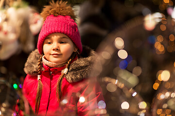 Image showing happy little girl at christmas market in winter