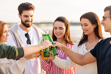 Image showing friends toasting non alcoholic drinks on beach