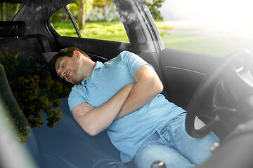 Image showing tired man or driver sleeping in car