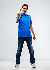 Image showing male fan with beer bottle celebrating victory