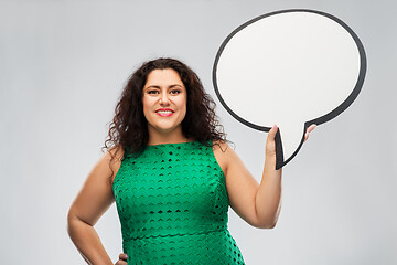 Image showing happy woman in green dress holding speech bubble