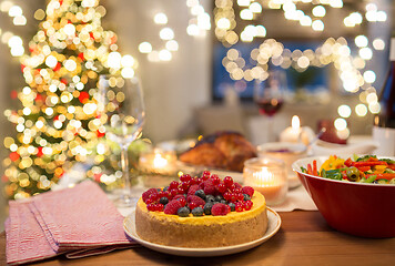 Image showing cake and other food on christmas table at home