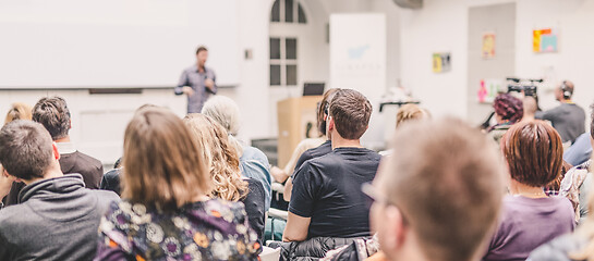 Image showing Man giving presentation in lecture hall at university.