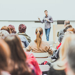 Image showing Public speaker giving talk at Business Event.